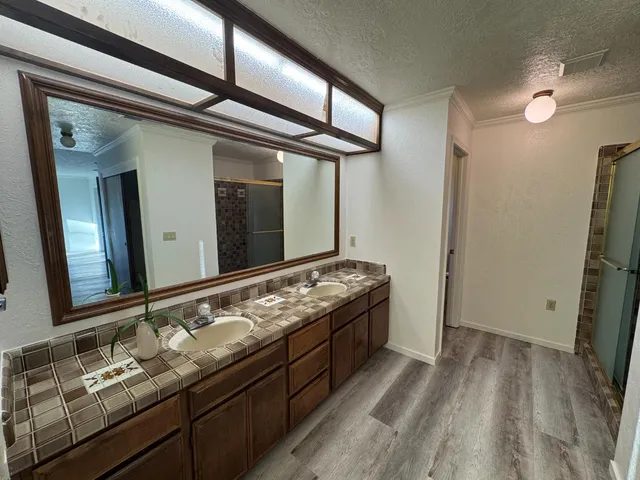 a bathroom with a bathtub and a window