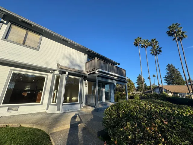 a view of a house with a small yard