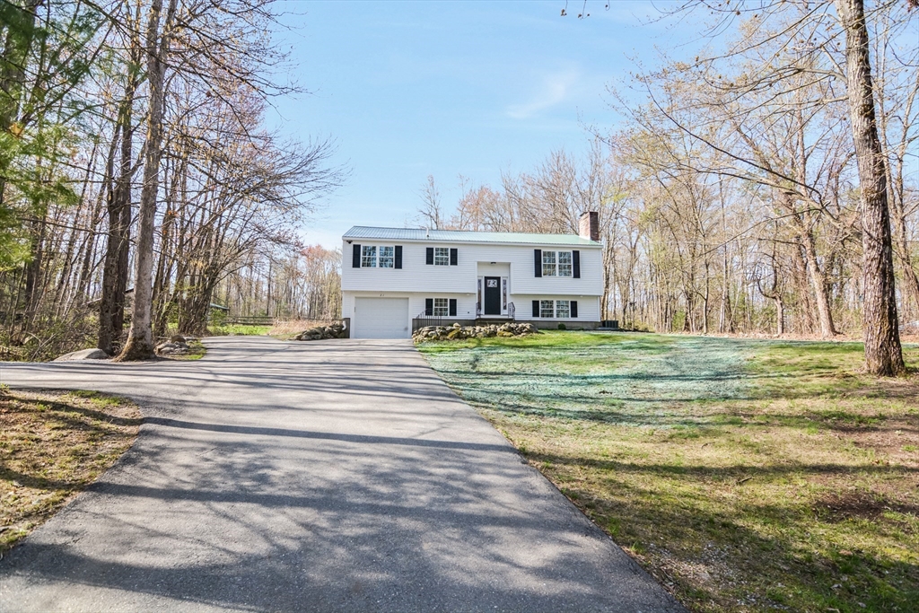 21 North End Road Townsend, MA 01469 - Photo 26 of 39 a view of a house with a big yard and large trees