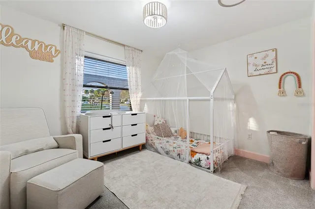 a bedroom with furniture and a window