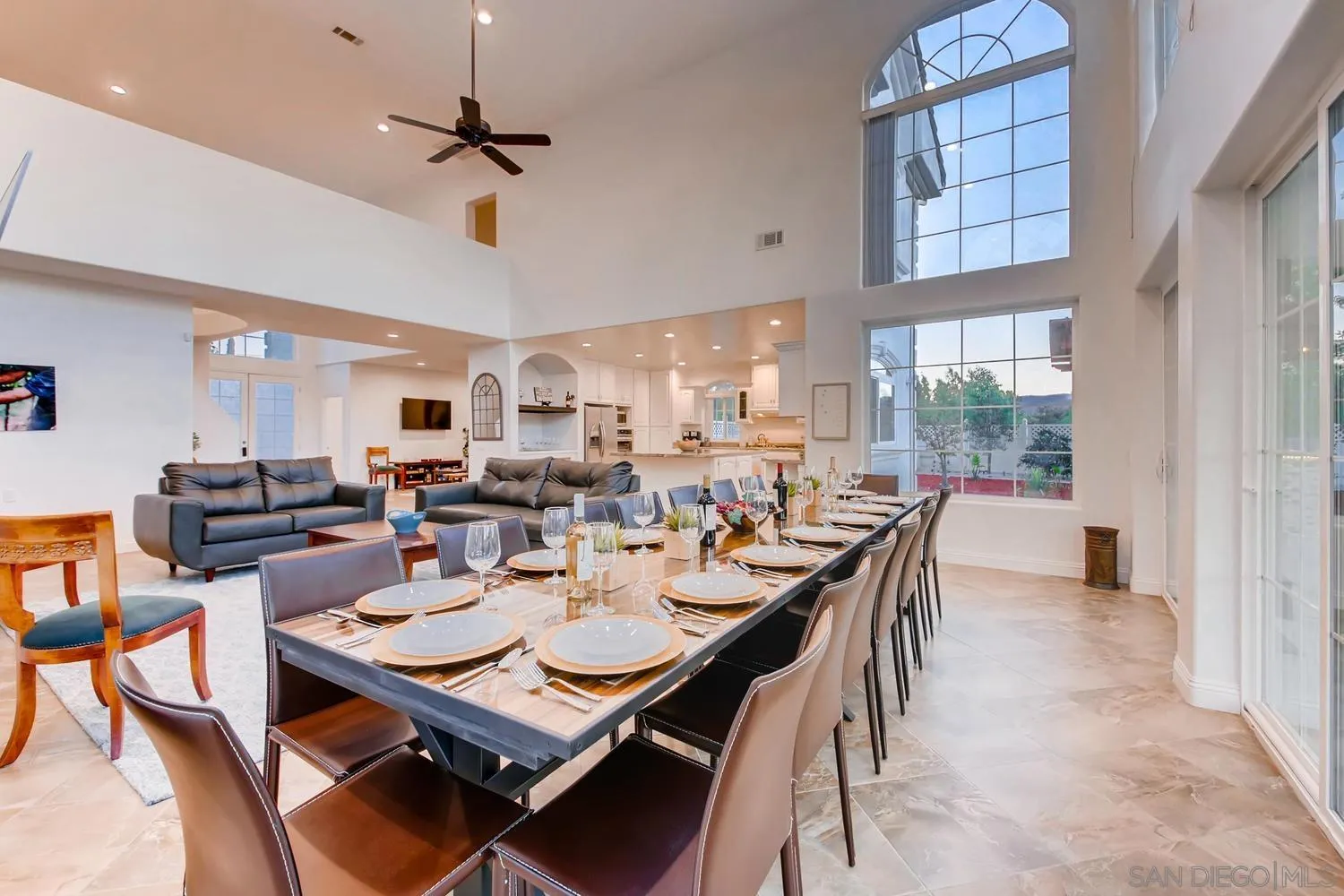 39575 Ave Ascencion Temecula, CA 92592 - Photo 13 of 68 a dining room with wooden floor a chandelier fan a wooden table and chairs