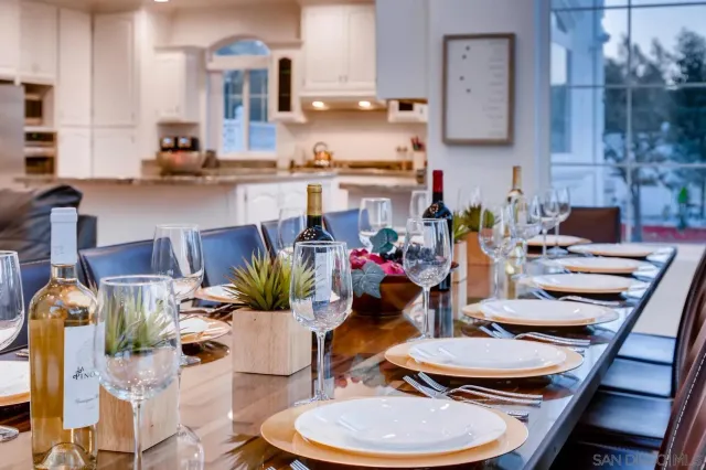 a kitchen with stainless steel appliances kitchen island granite countertop a refrigerator sink and cabinets