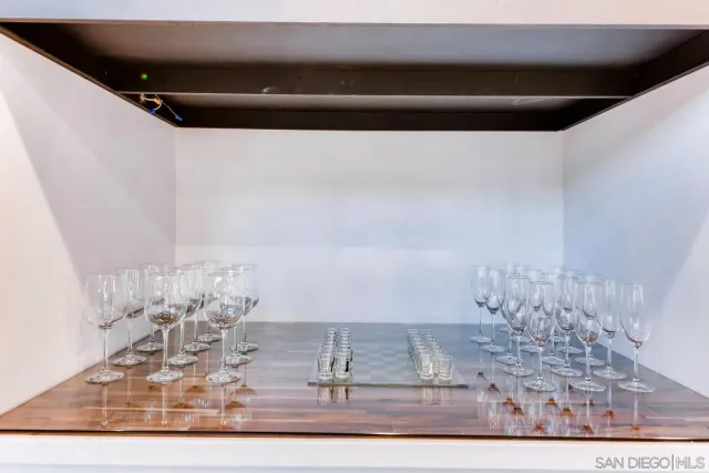 a bathroom with a sink a mirror a vanity and shower