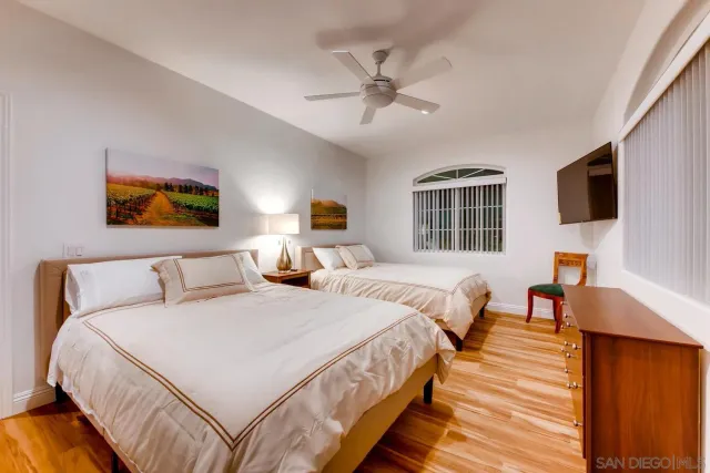 a living room with a bed furniture and a window