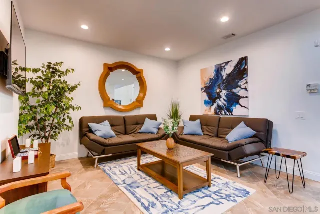 a view of a house with outdoor space and sitting area
