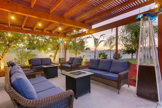 a view of a patio with swimming pool table and chairs