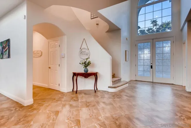 a living room with fireplace furniture and a flat screen tv