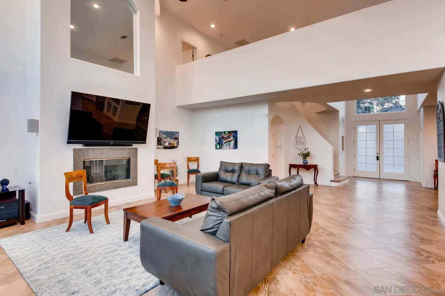 39575 Ave Ascencion Temecula, CA 92592 - Photo 9 of 68 a living room with furniture and a flat screen tv