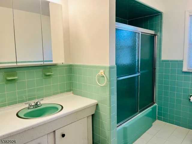 a bathroom with a sink and a shower