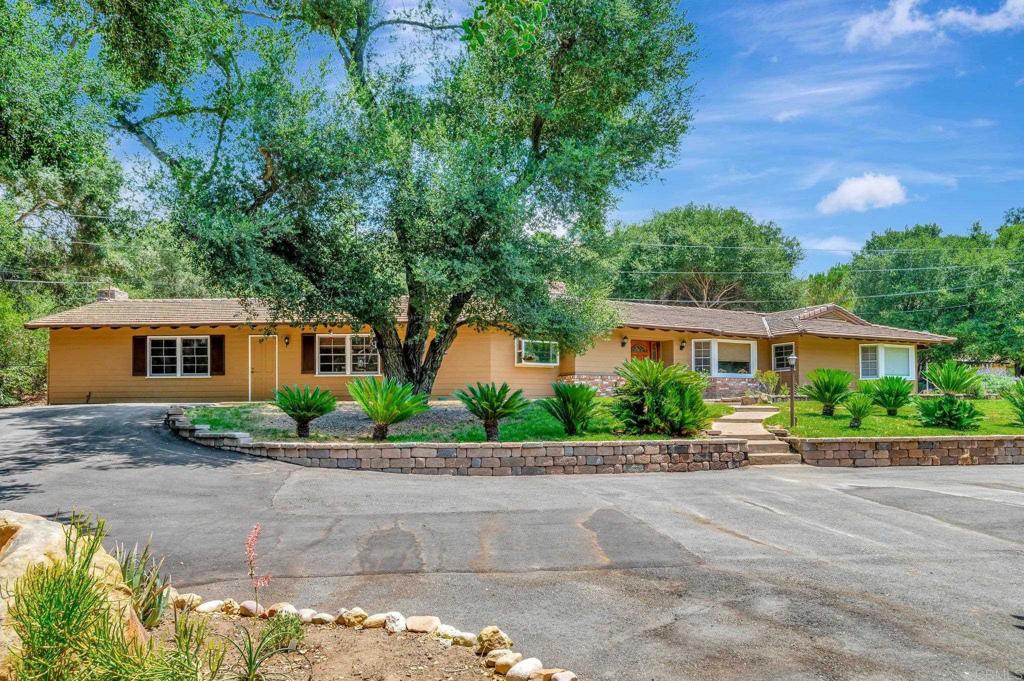 15765-75 Mussey Grade Road Ramona, CA 92065 - Photo 1 of 1 a front view of a house with a yard and a garage