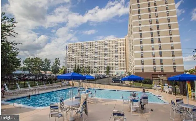 a balcony with table and chairs