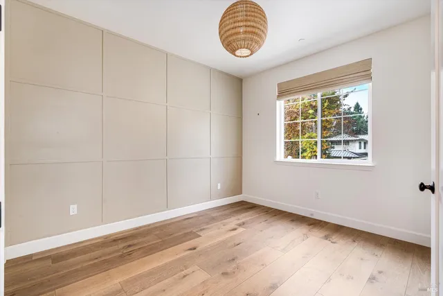 a view of a room with furniture window and wooden floor
