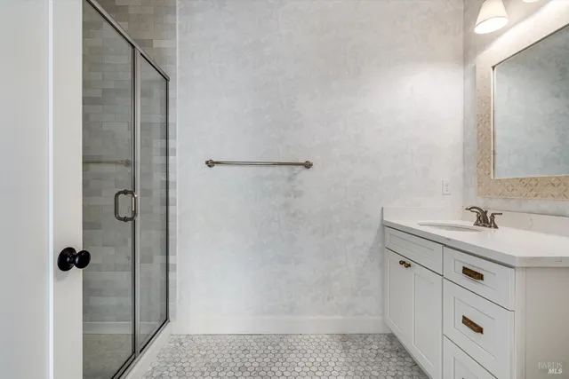 a view of a kitchen with a sink and a fireplace