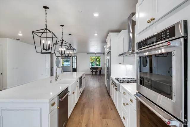 a bathroom with a granite countertop toilet a sink and a bathtub