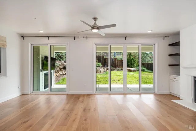 a view of a house with a yard patio and fire pit