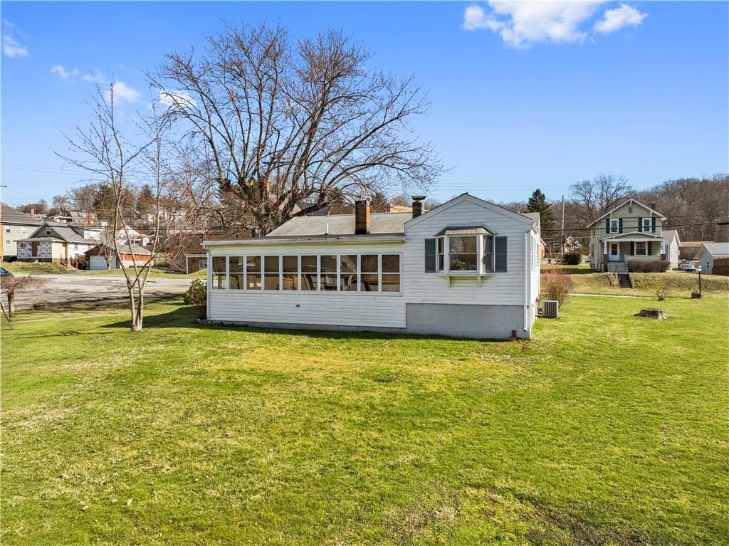 4700 Rochester Road New Brighton, PA 15066 - Photo 3 of 38 a view of a big yard with a house in the background