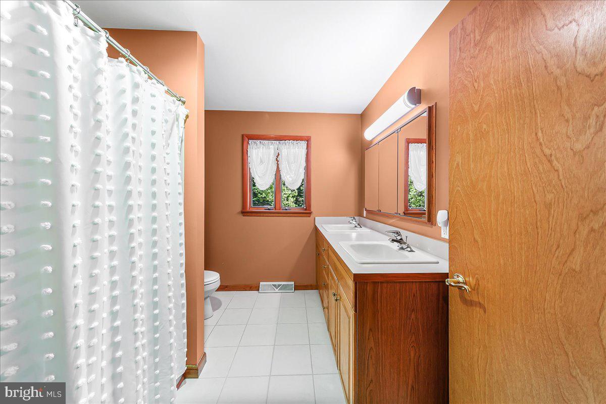 322 Buttonwood Road Landenberg, PA 19350 - Photo 28 of 60 Warm-toned bathroom with natural light.