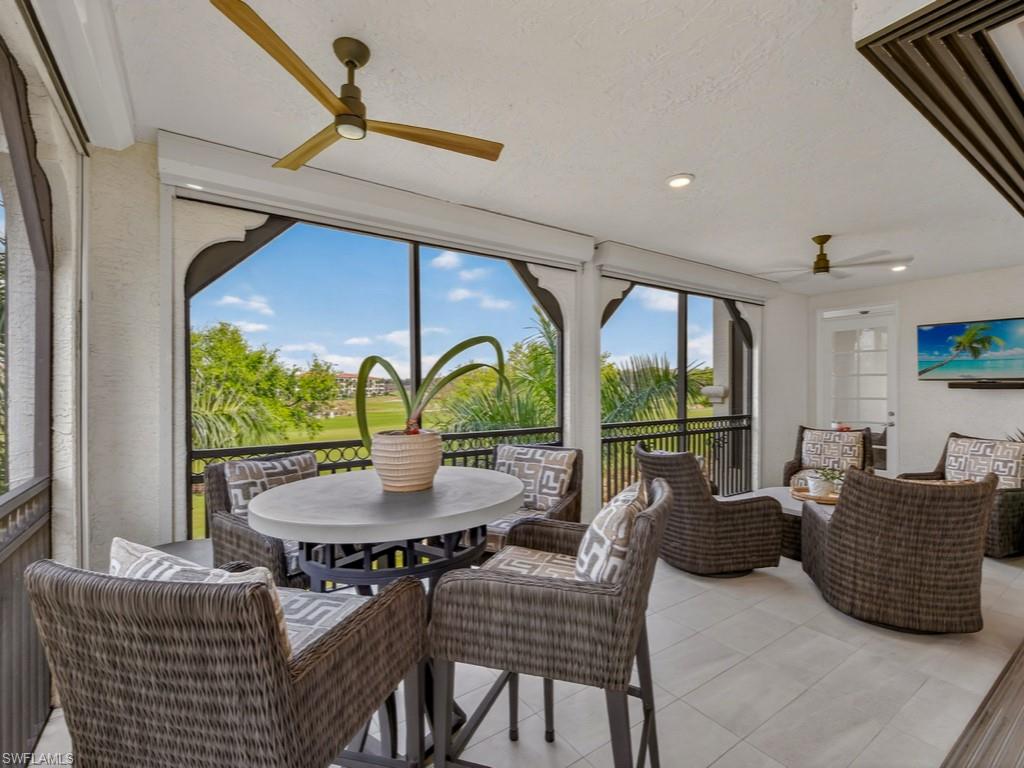 16371 Viansa Way, Unit 201 Naples, FL 34110 - Photo 2 of 42 a living room with furniture and a large window