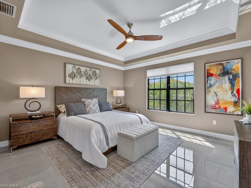 16371 Viansa Way, Unit 201 Naples, FL 34110 - Photo 21 of 42 a bedroom with a bed and window