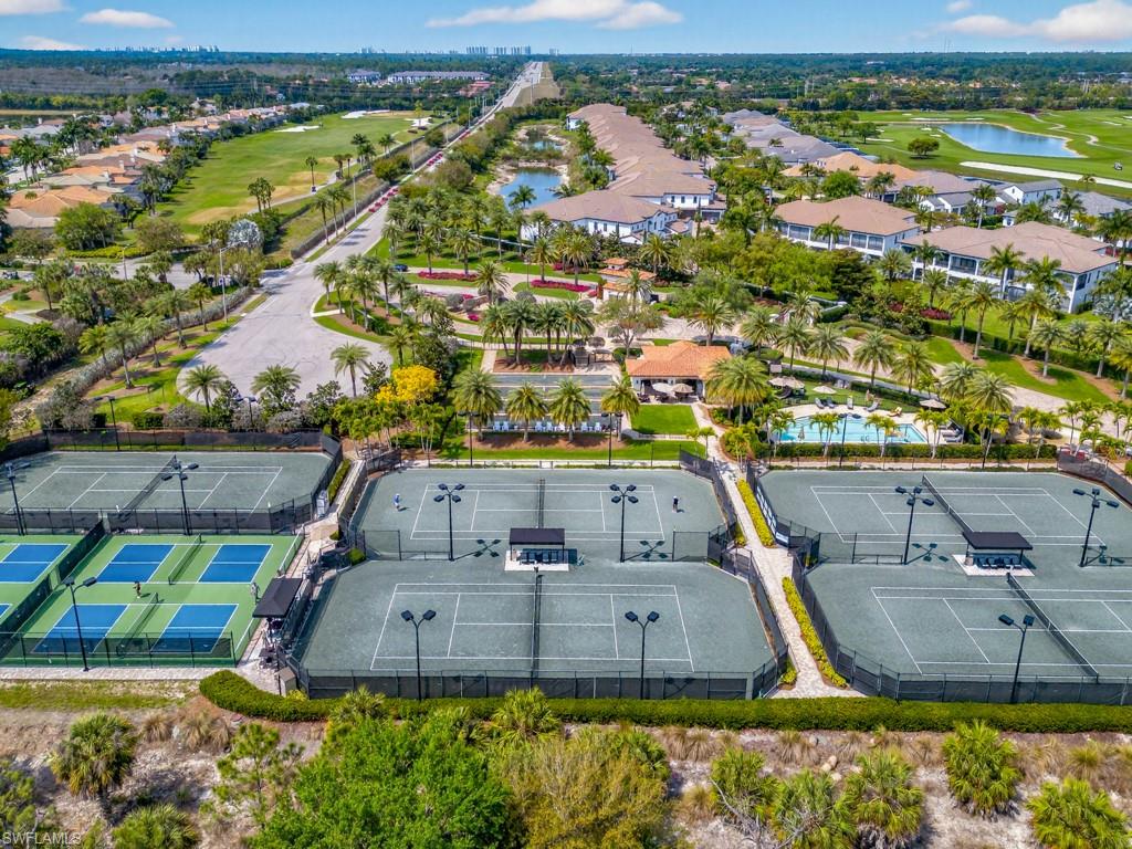16371 Viansa Way, Unit 201 Naples, FL 34110 - Photo 35 of 42 an aerial view of residential houses with outdoor space and swimming pool