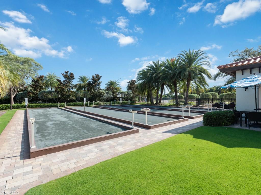 16371 Viansa Way, Unit 201 Naples, FL 34110 - Photo 37 of 42 a view of a park with swings and slides