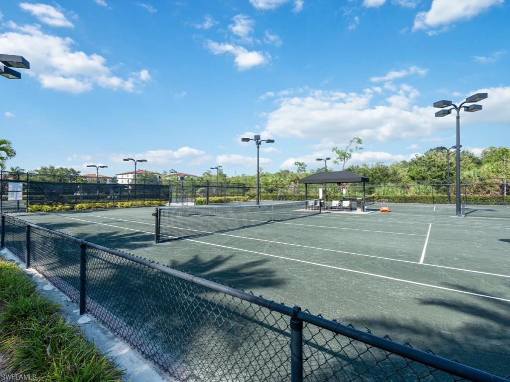 16371 Viansa Way, Unit 201 Naples, FL 34110 - Photo 38 of 42 a view of a tennis court