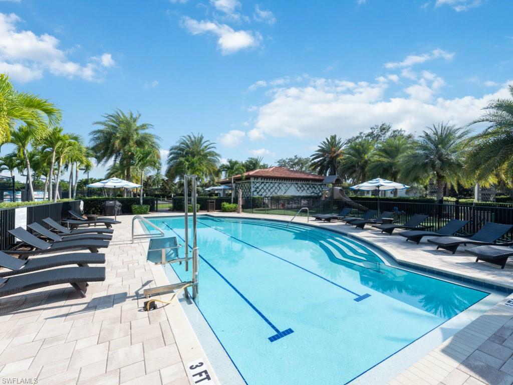 16371 Viansa Way, Unit 201 Naples, FL 34110 - Photo 40 of 42 a view of a swimming pool with chairs