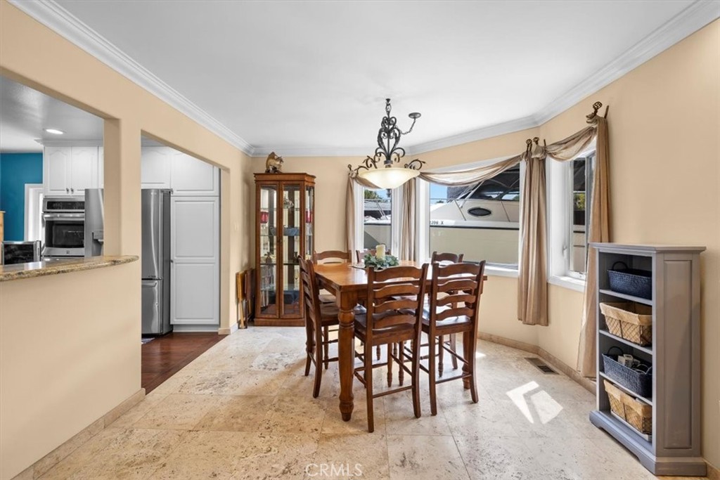 528 East 238th Place Carson, CA 90745 - Photo 13 of 75 a view of a dining room with furniture and chandelier