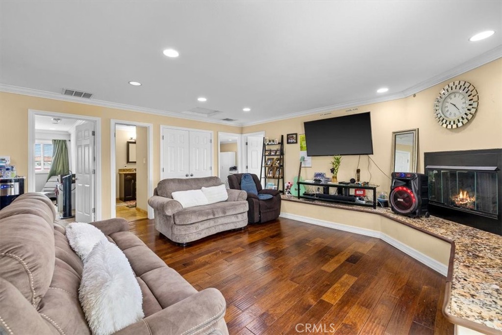 528 East 238th Place Carson, CA 90745 - Photo 14 of 75 a living room with furniture and a fireplace
