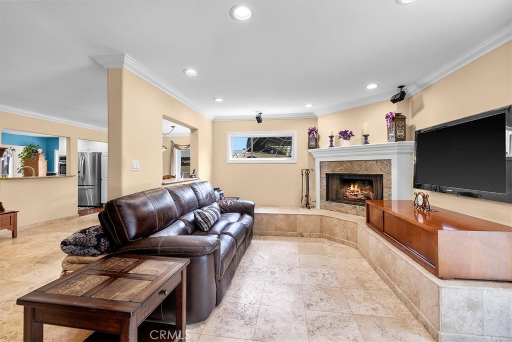 528 East 238th Place Carson, CA 90745 - Photo 15 of 75 a living room with furniture a flat screen tv and a fireplace