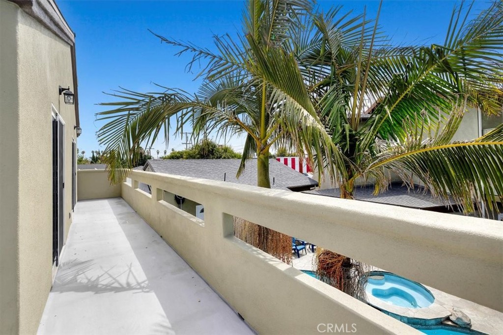 528 East 238th Place Carson, CA 90745 - Photo 25 of 75 a view of balcony with a potted plant and palm trees