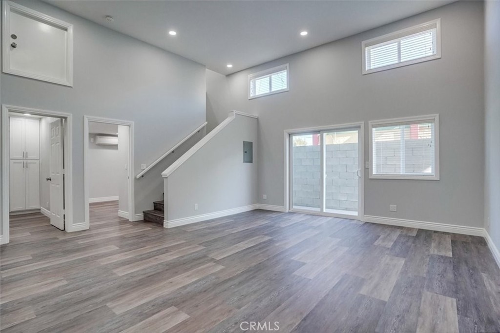 528 East 238th Place Carson, CA 90745 - Photo 33 of 75 an empty room with wooden floor and windows