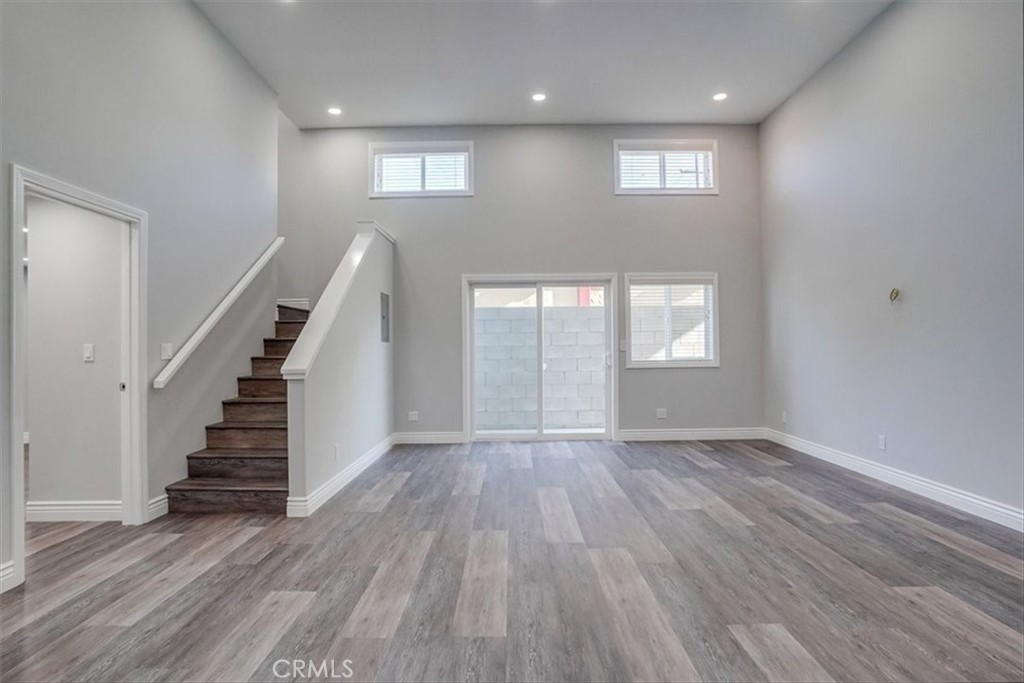 528 East 238th Place Carson, CA 90745 - Photo 34 of 75 an empty room with wooden floor and windows