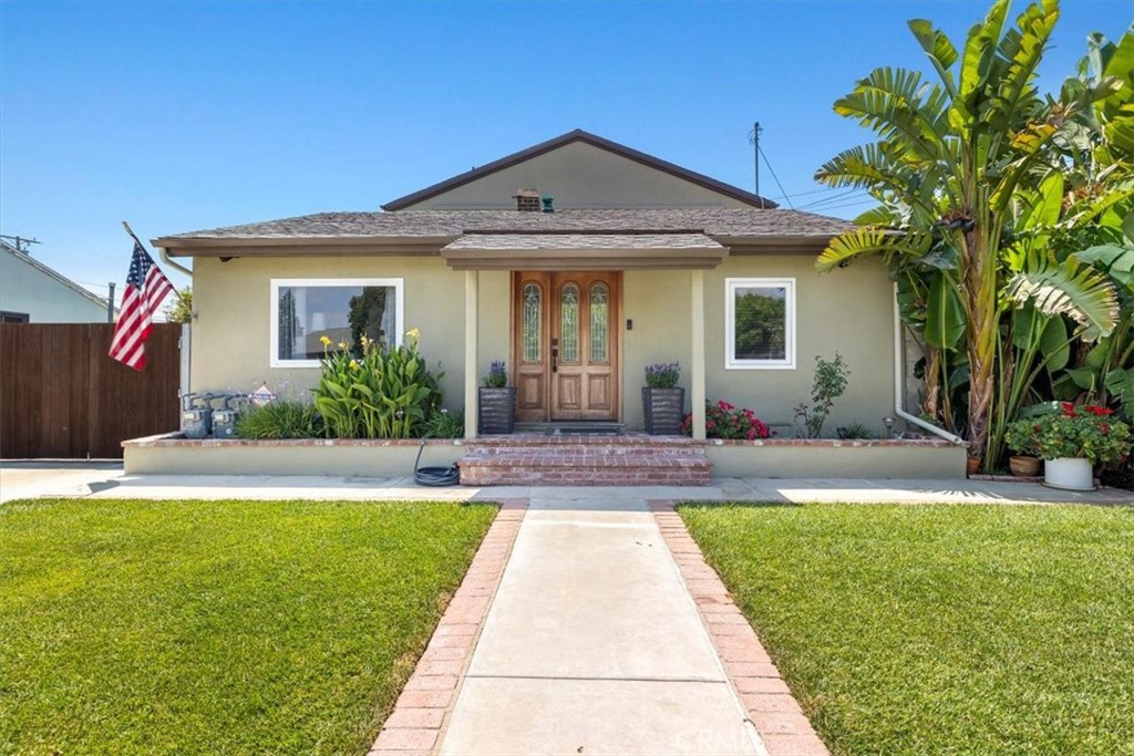 528 East 238th Place Carson, CA 90745 - Photo 4 of 75 a front view of a house with yard and green space