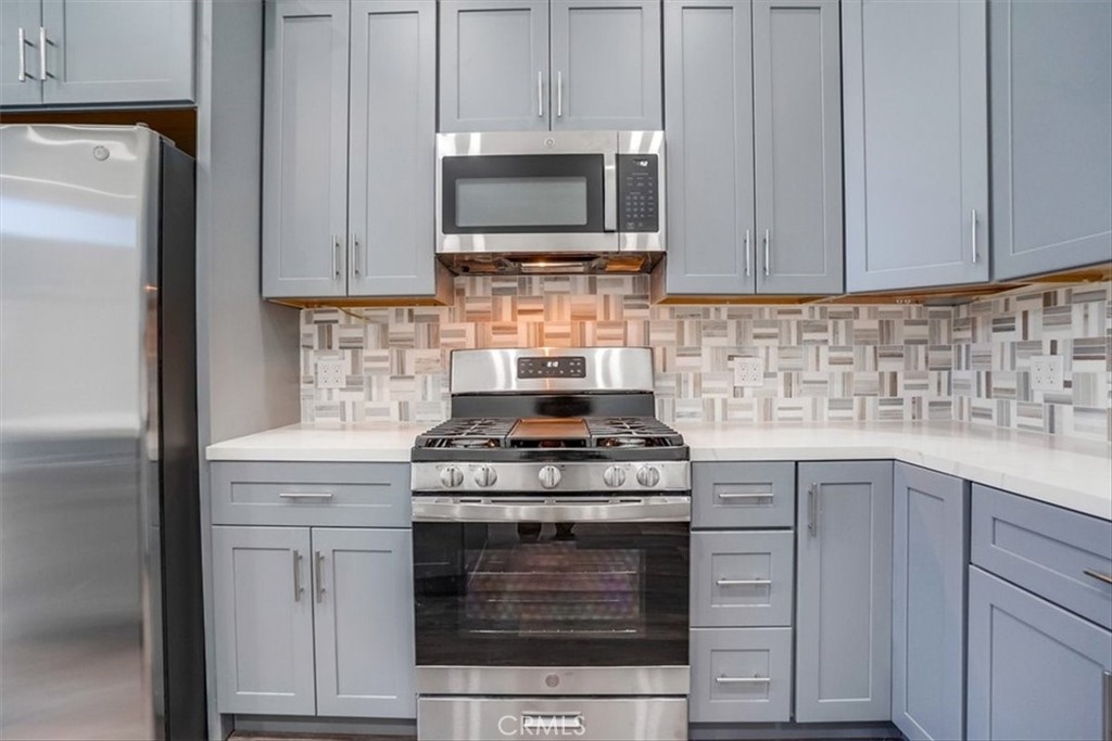 528 East 238th Place Carson, CA 90745 - Photo 43 of 75 a kitchen with cabinets stainless steel appliances and a sink