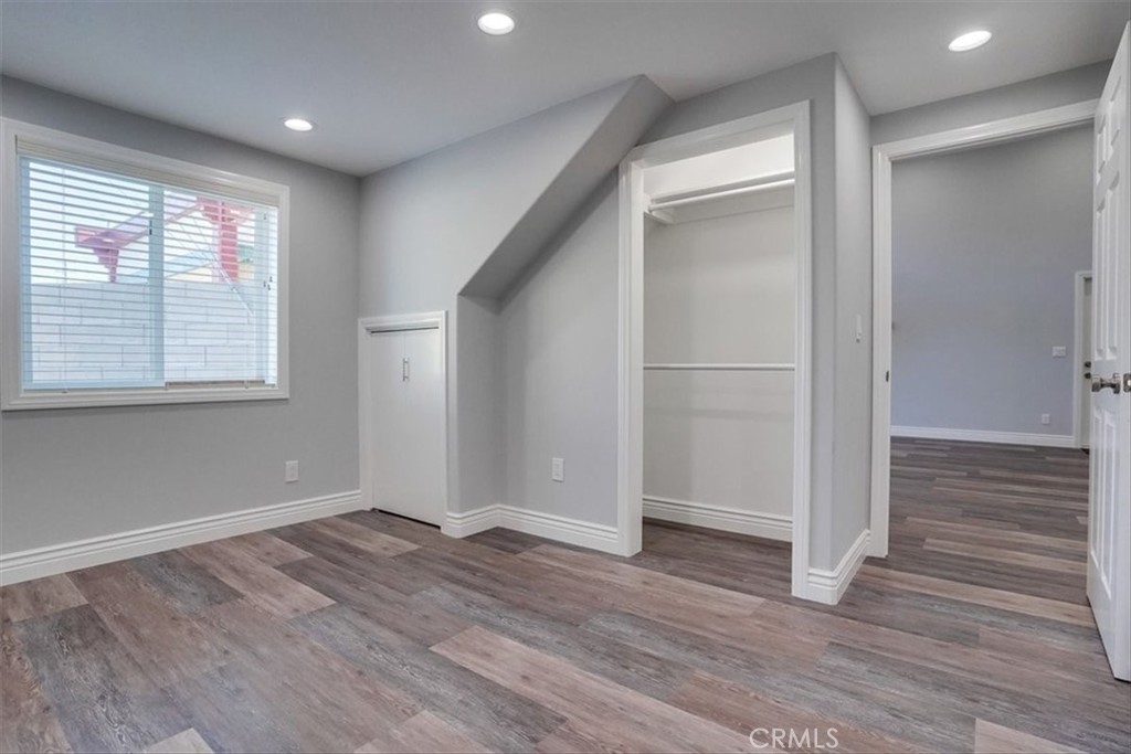 528 East 238th Place Carson, CA 90745 - Photo 50 of 75 an empty room with wooden floor and windows