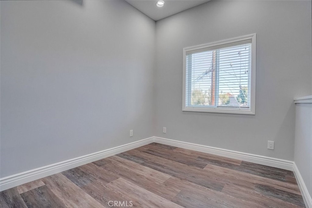 528 East 238th Place Carson, CA 90745 - Photo 51 of 75 an empty room with wooden floor and windows