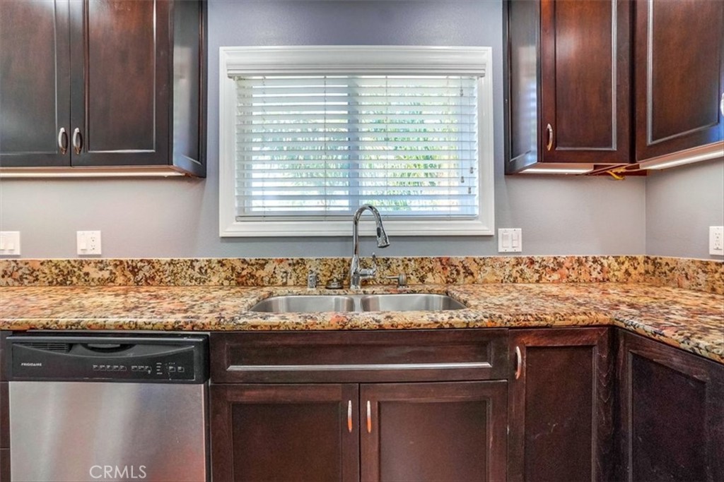 528 East 238th Place Carson, CA 90745 - Photo 67 of 75 a kitchen with granite countertop cabinets and window