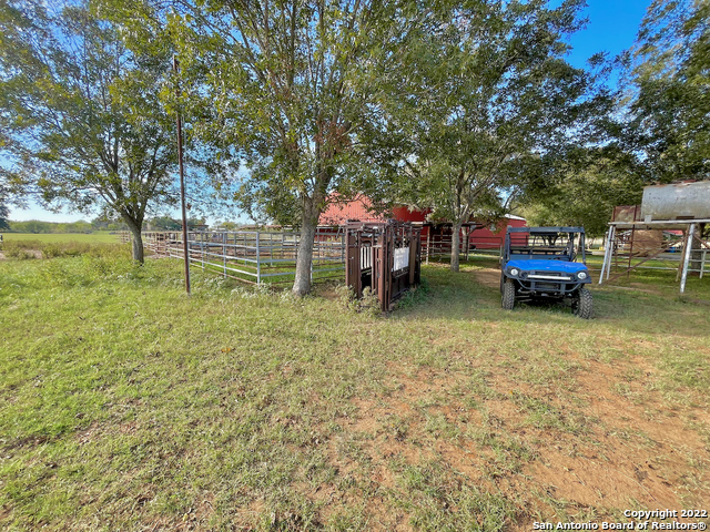 10671 Briggs Road Atascosa, TX 78002 - Photo 20 of 38 a backyard of a house with barbeque oven table and chairs
