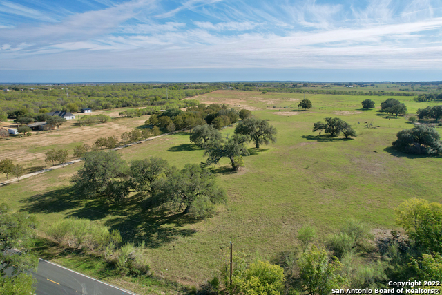 10671 Briggs Road Atascosa, TX 78002 - Photo 30 of 38 a view of a lake with a mountain