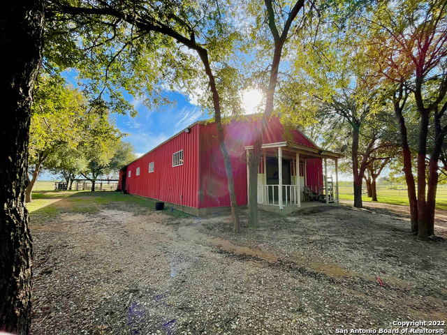 10671 Briggs Road Atascosa, TX 78002 - Photo 6 of 38 a view of a house with a yard and tree