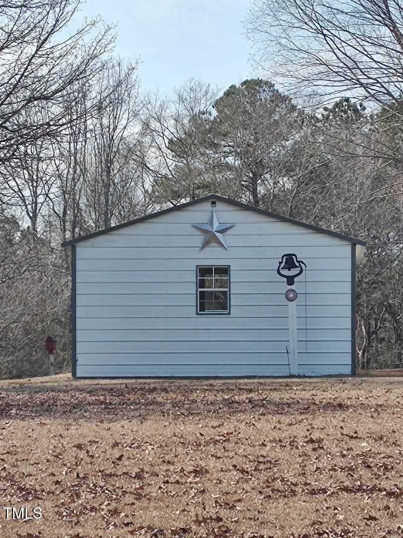 2960 Federal Road Benson, NC 27504 - Photo 5 of 45 Parking Garage, with Storage area rests beside the home for easy entry to the back door
