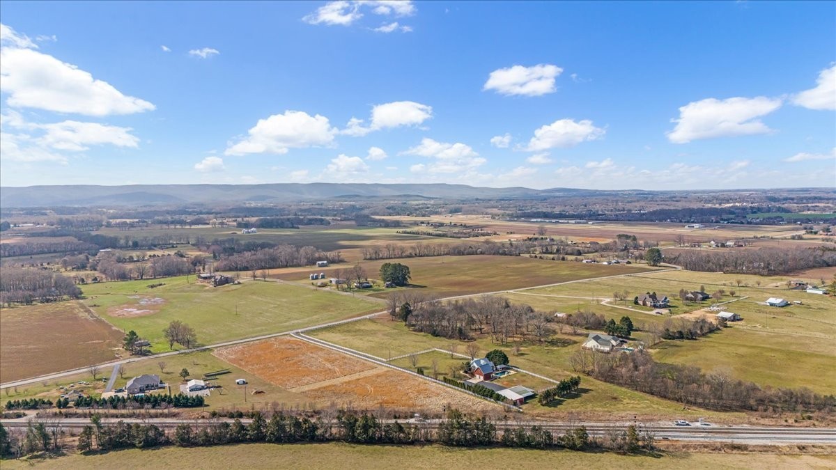 0 Georgia Crossing Road Winchester, TN 37398 - Photo 6 of 12 a view of a lake with a nearby beach