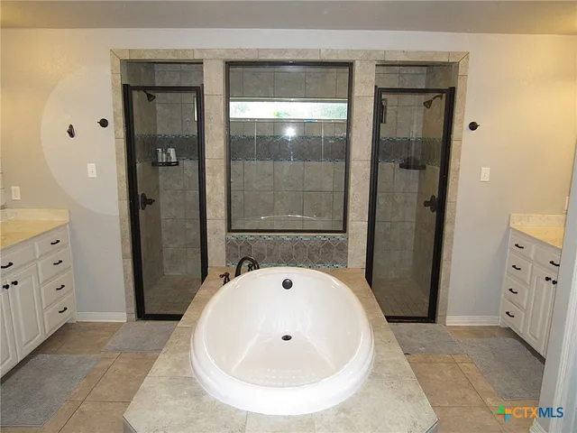 a bathroom with a bathtub and a sink