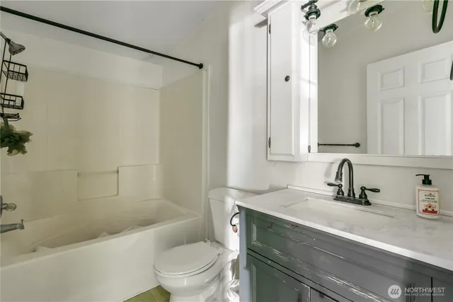 a bathroom with a sink a toilet and a bathtub