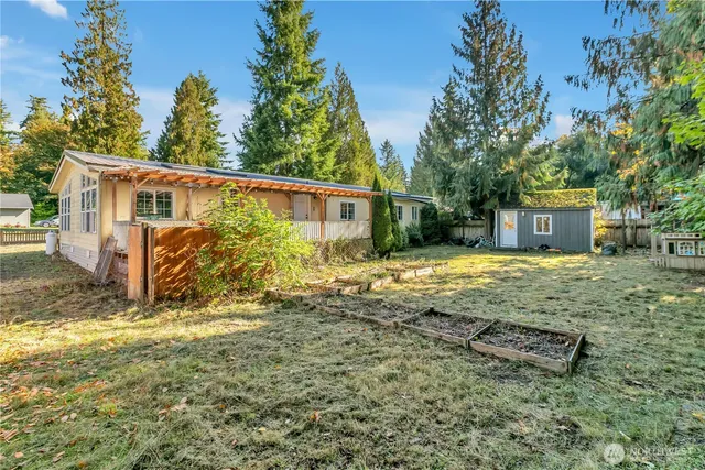 a view of a backyard of the house