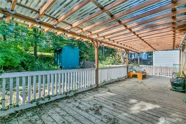a wooden bench sitting in front of a building