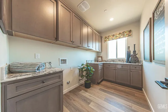 a kitchen with a sink cabinets and window