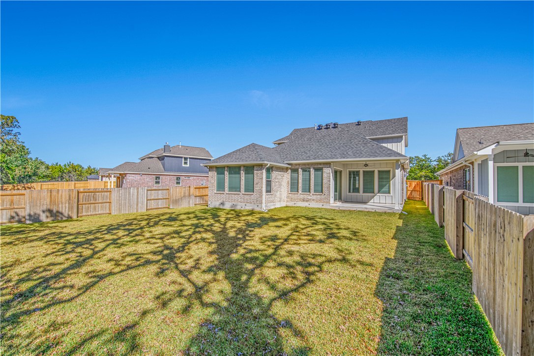 1652 Frontera Ranch Boulevard College Station, TX 77845 - Photo 26 of 29 a view of a house with pool and wooden fence