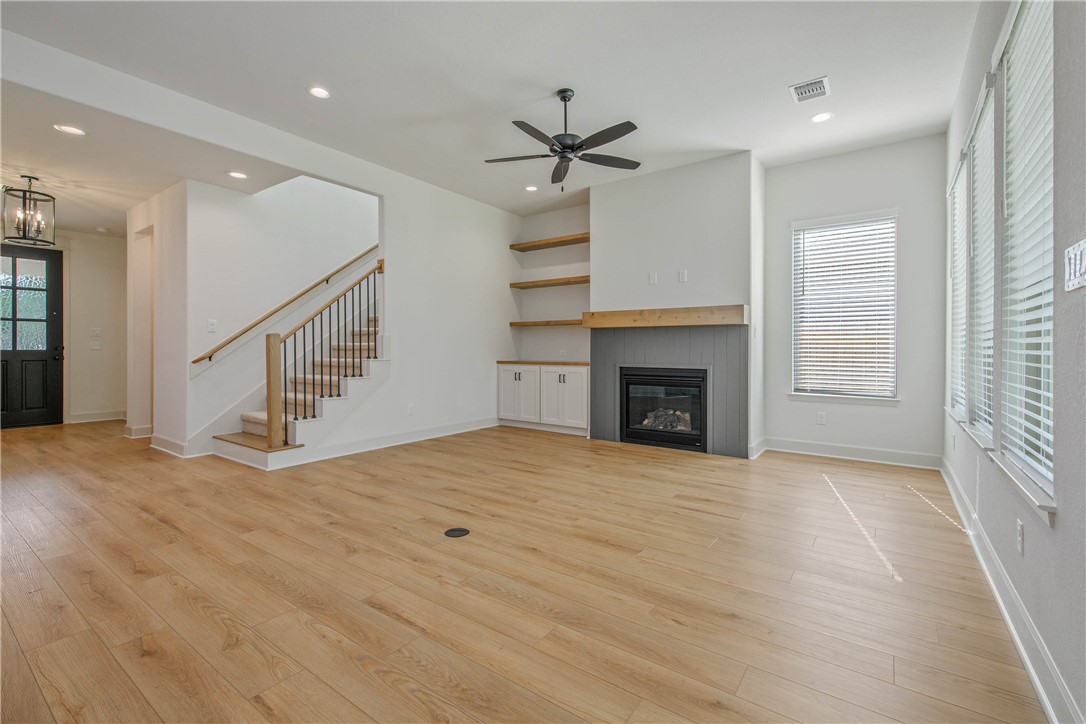 1652 Frontera Ranch Boulevard College Station, TX 77845 - Photo 6 of 29 a view of an empty room with a fireplace and a window
